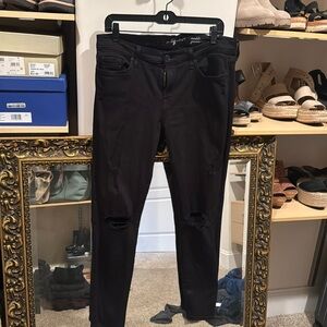 7 for all mankind black ankle jean with rip details